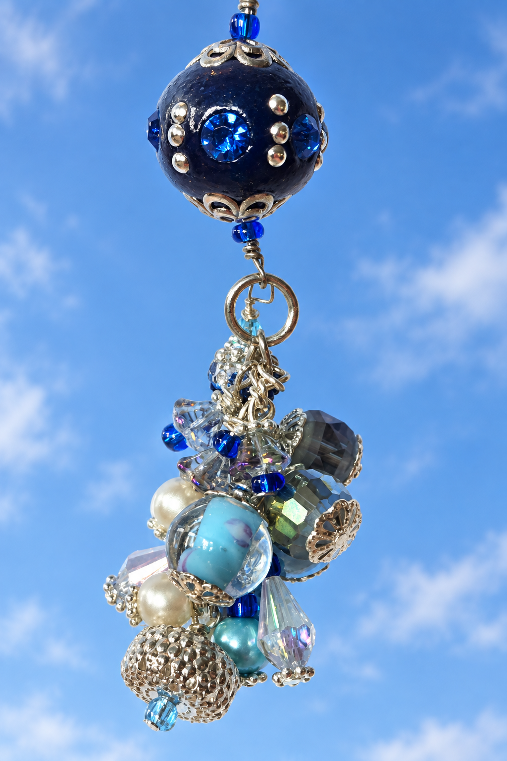 Blue balloon accessory against an open sky