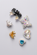 Decorative charms on soft light grey