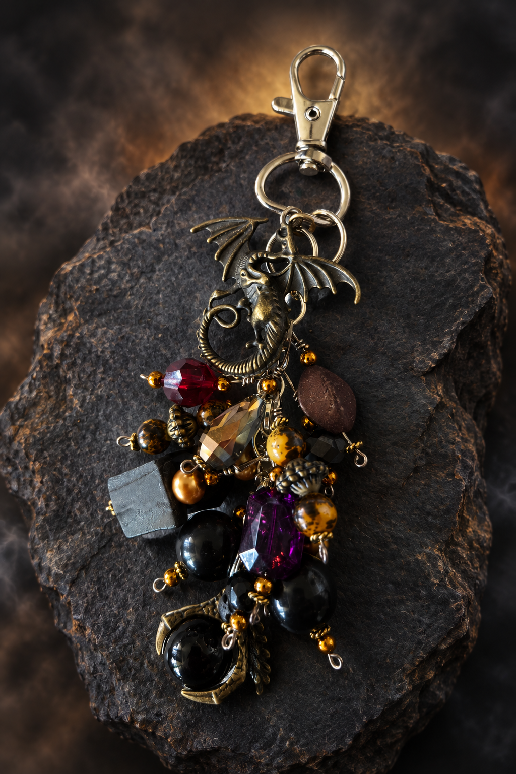 Dragon keeper beaded accessory displayed on dark rocky slate