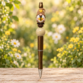 Gnome sweetheart pen with a bee-holding gnome topper in a sunny cottage garden